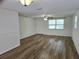 Bright living room with new wood laminate flooring, ceiling fan and plenty of natural light at 6317 Buster Dr, Tampa, FL 33619