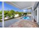 Inviting backyard features a pool, patio area, and lush greenery, perfect for outdoor entertaining at 6536 115Th Ln, Seminole, FL 33772