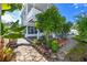 Backyard with lush foliage, a small pool, a paved walkway, and the exterior of the home in view at 6536 115Th Ln, Seminole, FL 33772