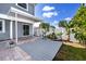 Backyard with a patio area and tropical landscaping, offering a relaxing and private outdoor space at 6536 115Th Ln, Seminole, FL 33772