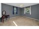 Comfortable bedroom with plush carpet, soft lighting, and dual windows at 6536 115Th Ln, Seminole, FL 33772