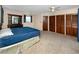 Spacious bedroom with neutral carpet, built-in storage, and a comfortable ambiance at 6536 115Th Ln, Seminole, FL 33772