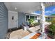 Charming front porch of a cozy home featuring a brick walkway and decorative columns at 6536 115Th Ln, Seminole, FL 33772