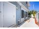 Exterior view showcasing the side of the house with access to the backyard and sunroom at 6536 115Th Ln, Seminole, FL 33772
