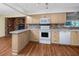 Well-lit kitchen featuring updated stainless steel appliances, breakfast bar, and neutral color palette at 6536 115Th Ln, Seminole, FL 33772