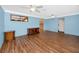 Spacious living room with hardwood floors, light blue walls, and classic furnishings at 6536 115Th Ln, Seminole, FL 33772