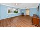 Bright living room featuring hardwood floors, white trim, and lots of light from windows with shutters at 6536 115Th Ln, Seminole, FL 33772