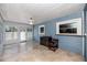 Light-filled sunroom featuring tile floors, a ceiling fan, and views of the home's exterior at 6536 115Th Ln, Seminole, FL 33772
