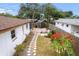 Aerial view of the backyard featuring a patio, gazebo, and mature trees at 6801 Pinellas Point S Dr, St Petersburg, FL 33712