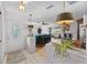 Inviting foyer showcasing stylish light fixtures, decorative brick features, and a seamless transition to the living areas at 6801 Pinellas Point S Dr, St Petersburg, FL 33712