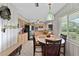 Charming kitchen showcasing bright cabinetry, modern appliances, and a cozy dining area at 6801 Pinellas Point S Dr, St Petersburg, FL 33712
