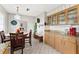 Charming eat-in kitchen featuring tile floors, neutral cabinetry, and granite countertops at 6801 Pinellas Point S Dr, St Petersburg, FL 33712