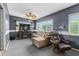 Cozy Gathering room featuring modern entertainment setup, comfortable seating, and plenty of natural light at 6801 Pinellas Point S Dr, St Petersburg, FL 33712