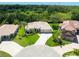Expansive aerial view showcasing the meticulously maintained lawn and curb appeal of this home at 6933 Cozumel Ct, Land O Lakes, FL 34637