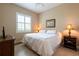 Light and bright bedroom with large window and ceiling fan at 6933 Cozumel Ct, Land O Lakes, FL 34637