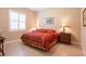 Comfortable bedroom with a plush bed, window and dresser at 6933 Cozumel Ct, Land O Lakes, FL 34637