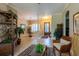 Inviting foyer with tile flooring, decorative rug, and a wicker armchair at 6933 Cozumel Ct, Land O Lakes, FL 34637