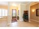 Inviting foyer with decorative glass front door, tile floors, and tasteful decor creating a warm welcome at 6933 Cozumel Ct, Land O Lakes, FL 34637