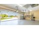 Well-lit garage offering ample space, with room for 2 cars and storage, featuring epoxy-coated floors and clean walls at 6933 Cozumel Ct, Land O Lakes, FL 34637