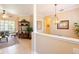 Bright and airy living room featuring neutral walls, tile flooring, and seamless access to the outdoor space at 6933 Cozumel Ct, Land O Lakes, FL 34637