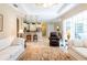 Spacious living room with tile floors, a large rug, comfortable seating, and open access to the kitchen at 6933 Cozumel Ct, Land O Lakes, FL 34637