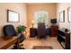 Well-lit home office with a large window, desk, and comfortable executive chair at 6933 Cozumel Ct, Land O Lakes, FL 34637