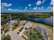 A high angle view of a waterfront neighborhood with a school and recreation area at 699 Merlins Ct, Tarpon Springs, FL 34689