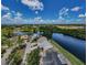 Aerial view of a waterfront property showcasing community and water access at 699 Merlins Ct, Tarpon Springs, FL 34689