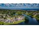 Picturesque aerial view of waterfront homes with lush green landscaping and stunning water views at 699 Merlins Ct, Tarpon Springs, FL 34689