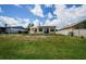 Well-maintained backyard with lawn and patio, perfect for outdoor enjoyment and relaxation at 699 Merlins Ct, Tarpon Springs, FL 34689
