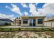 The backyard features a concrete patio and outdoor seating at 699 Merlins Ct, Tarpon Springs, FL 34689