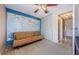 Bedroom featuring a lake view window, world map wall decor, and closet at 699 Merlins Ct, Tarpon Springs, FL 34689
