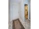 Foyer boasts tile flooring and leads to a closet or pantry with custom shelving at 699 Merlins Ct, Tarpon Springs, FL 34689