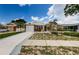 Welcoming one-story house shows a spacious driveway, healthy lawn, and stylish stone features at 699 Merlins Ct, Tarpon Springs, FL 34689