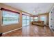 Sunroom with tile flooring, ceiling fan and large windows with lovely water views at 699 Merlins Ct, Tarpon Springs, FL 34689