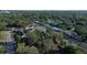 Wide aerial shot of a quiet neighborhood lined with mature trees and well-maintained houses at 7014 Doreen St, Tampa, FL 33617