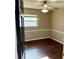 Bedroom features wood-look floors, ceiling fan and trim along the walls at 7014 Doreen St, Tampa, FL 33617