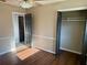 Comfortable bedroom featuring wood flooring and a ceiling fan at 7014 Doreen St, Tampa, FL 33617