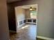 Dining room with a fan, neutral walls, tile floor, and a window with natural light at 7014 Doreen St, Tampa, FL 33617