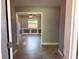 View from the entryway into the dining room, showcasing tile flooring and crown molding at 7014 Doreen St, Tampa, FL 33617