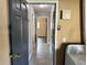 Hallway with a laundry area at the end at 7014 Doreen St, Tampa, FL 33617