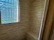 Close up view of tiled shower and glass block window at 7014 Doreen St, Tampa, FL 33617