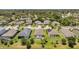 Aerial view of neighborhood homes with manicured lawns and screened pools at 764 W Bayshore Dr, Tarpon Springs, FL 34689