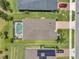 Aerial view of backyard with pool, patio area, and lush green lawn at 764 W Bayshore Dr, Tarpon Springs, FL 34689