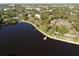 Expansive aerial view of a waterfront property showcasing lush landscaping, docks, and stunning architectural design at 764 W Bayshore Dr, Tarpon Springs, FL 34689