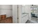 Open view of the bathroom with double vanity, walk-in closet, and bedroom at 764 W Bayshore Dr, Tarpon Springs, FL 34689
