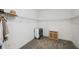 Walk-in closet with wire shelving, carpet, and a storage unit with wicker baskets at 764 W Bayshore Dr, Tarpon Springs, FL 34689