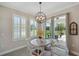 Charming breakfast nook with natural light from large windows, complete with views of the outdoor patio at 764 W Bayshore Dr, Tarpon Springs, FL 34689