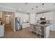 Modern kitchen features stainless steel appliances, granite countertops, and a breakfast bar at 764 W Bayshore Dr, Tarpon Springs, FL 34689