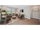 Inviting living room with wood floors, comfortable seating, and natural light from bright windows with shutters at 764 W Bayshore Dr, Tarpon Springs, FL 34689